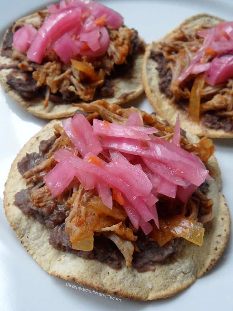 How to make cochinita pibil in a slow-cooker or Crock-Pot via theothersideofthetortilla.com