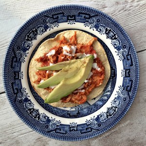 How to make tinga de pollo, a Mexican dish with a tomato base and shredded chicken. Great for tostadas, tacos, served with rice, or as a quesadilla! This dish is also sometimes known as tinga poblana or chicken tinga. Recipe via @MauraHernandez on The Other Side of The Tortilla.