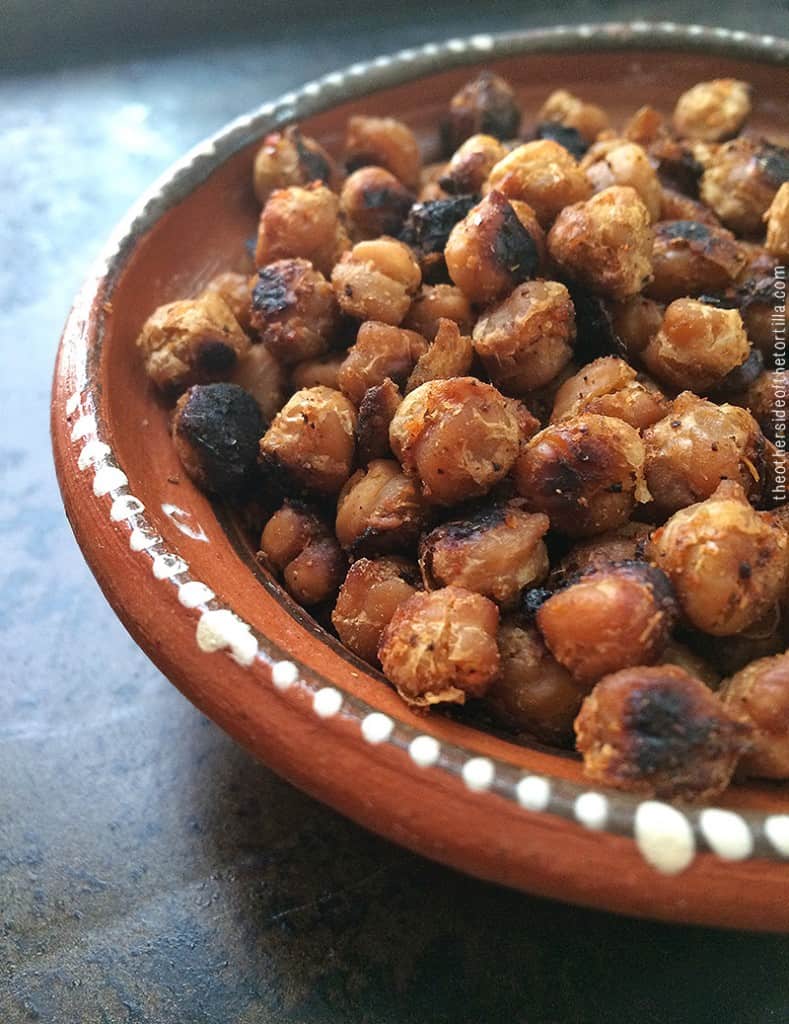 A roasted chickpea recipe made with safflower or grapeseed oil, lime juice, tajín and ground cumin. Gluten-free and vegan-friendly! Get the full recipe on theothersideofthetortilla.com.