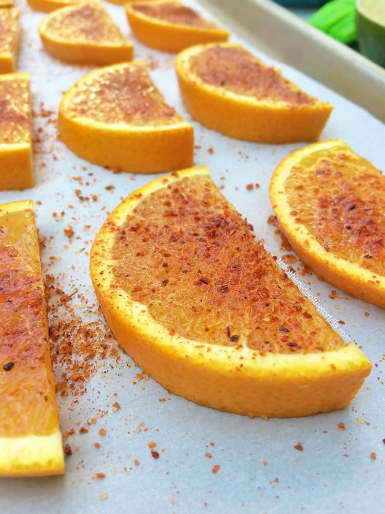 Orange slices with lime and Tajín