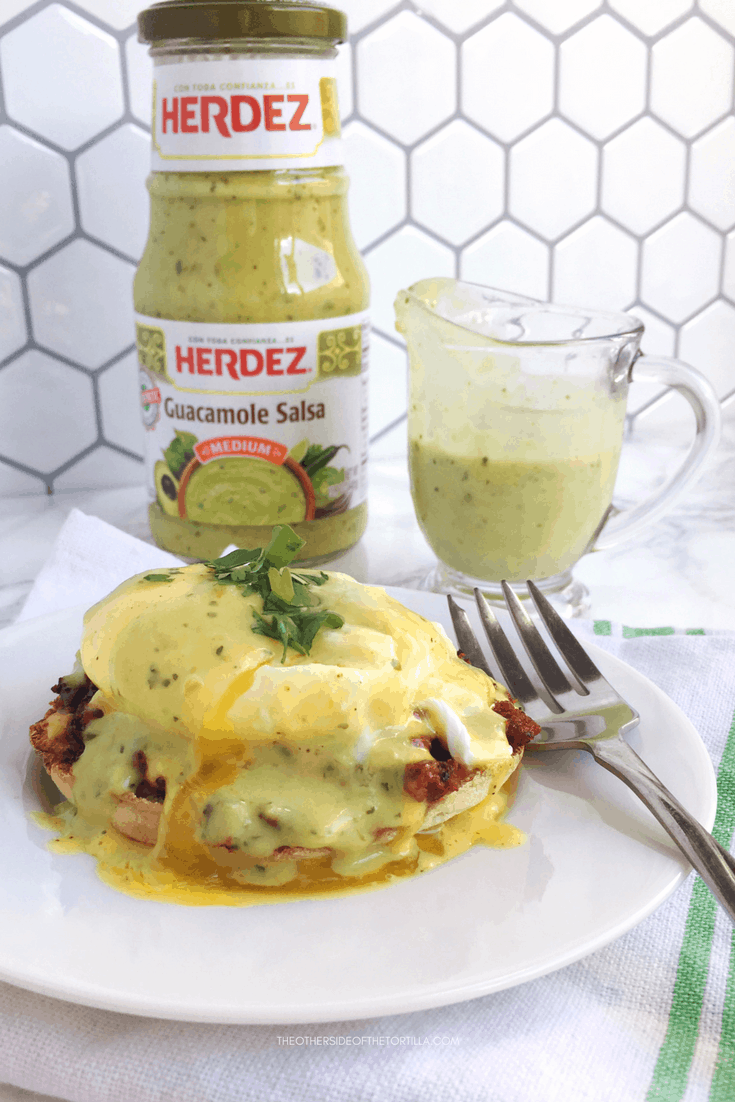 How to make Mexican eggs benedict with an ancho hollandaise, and topped with Herdez guacamole salsa. Recipe via theothersideofthetortilla.com