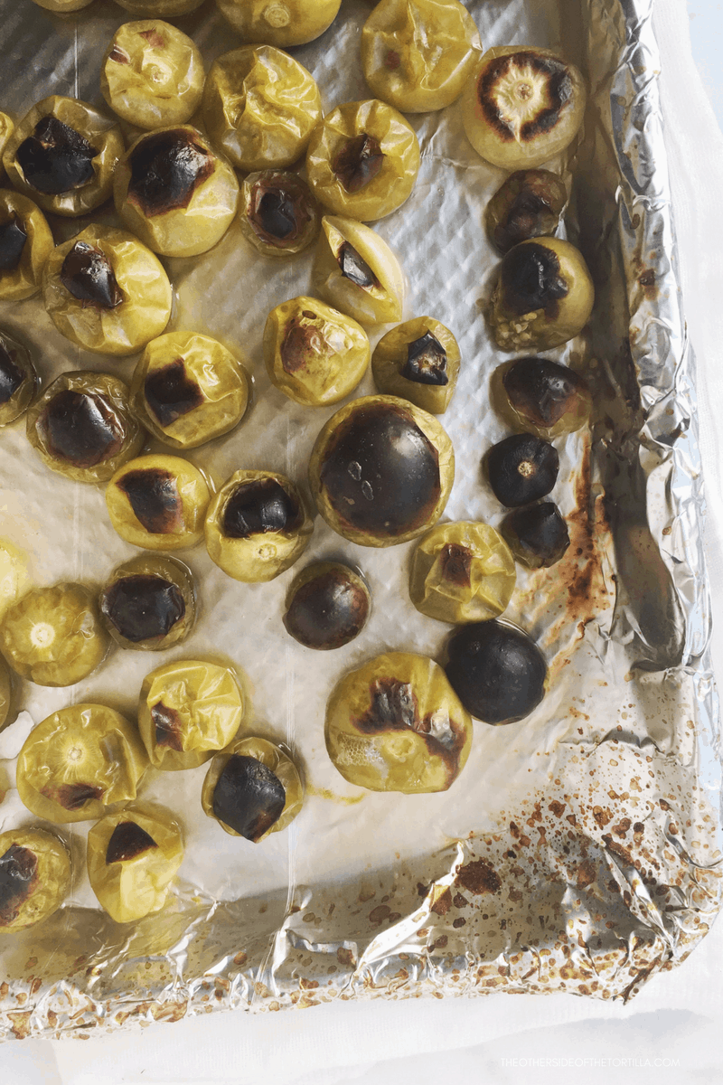 Roasting tomatillos to make salsa de chile morita