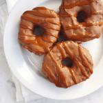 Mexican chocolate-glazed doughnuts drizzled with dulce de leche