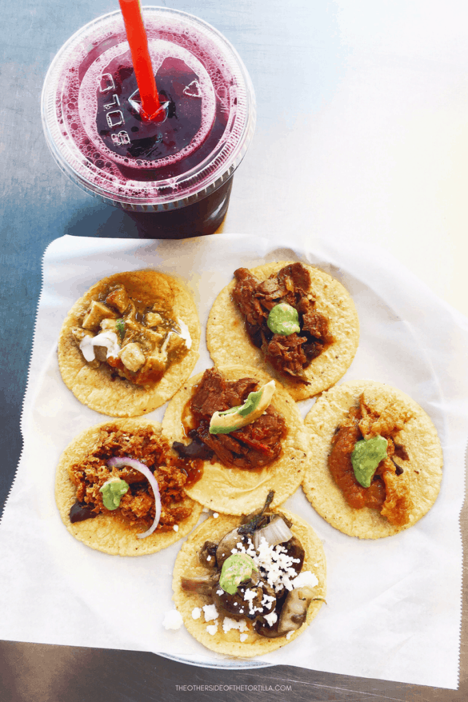 Taco Sampler and jamaica agua fresca at Guisados in Los Angeles, California