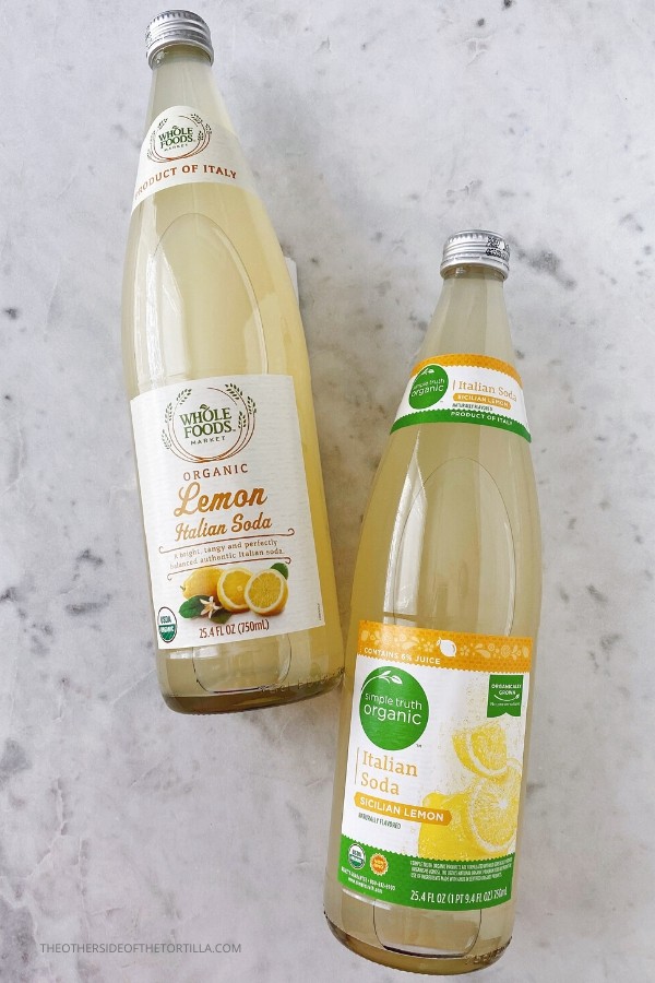 Bottles of Whole Foods organic lemon Italian soda and Simple Truth Organic Italian soda in Sicilian lemon flavor