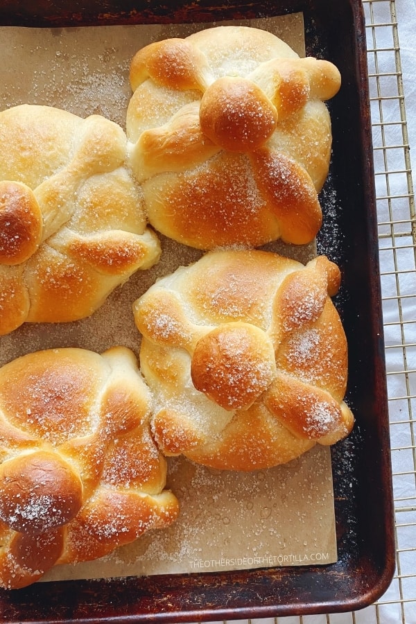 close up of Mexican pan de muerto on a baking sheet